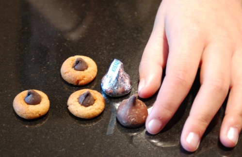 You can see by comparing Emma's hand to these peanut butter thumbprint cookies just how teeny they are.